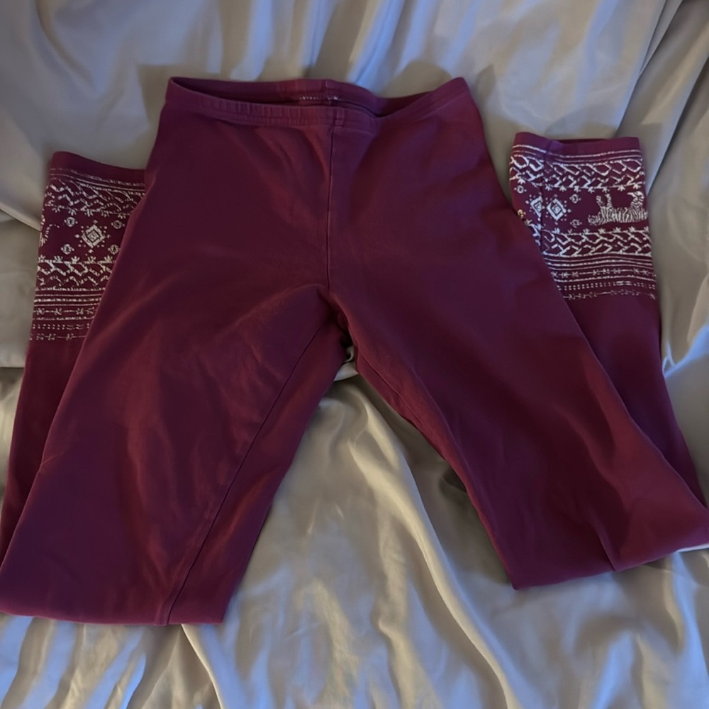 size Large in kids leggings with designs at the end (worn a few times)